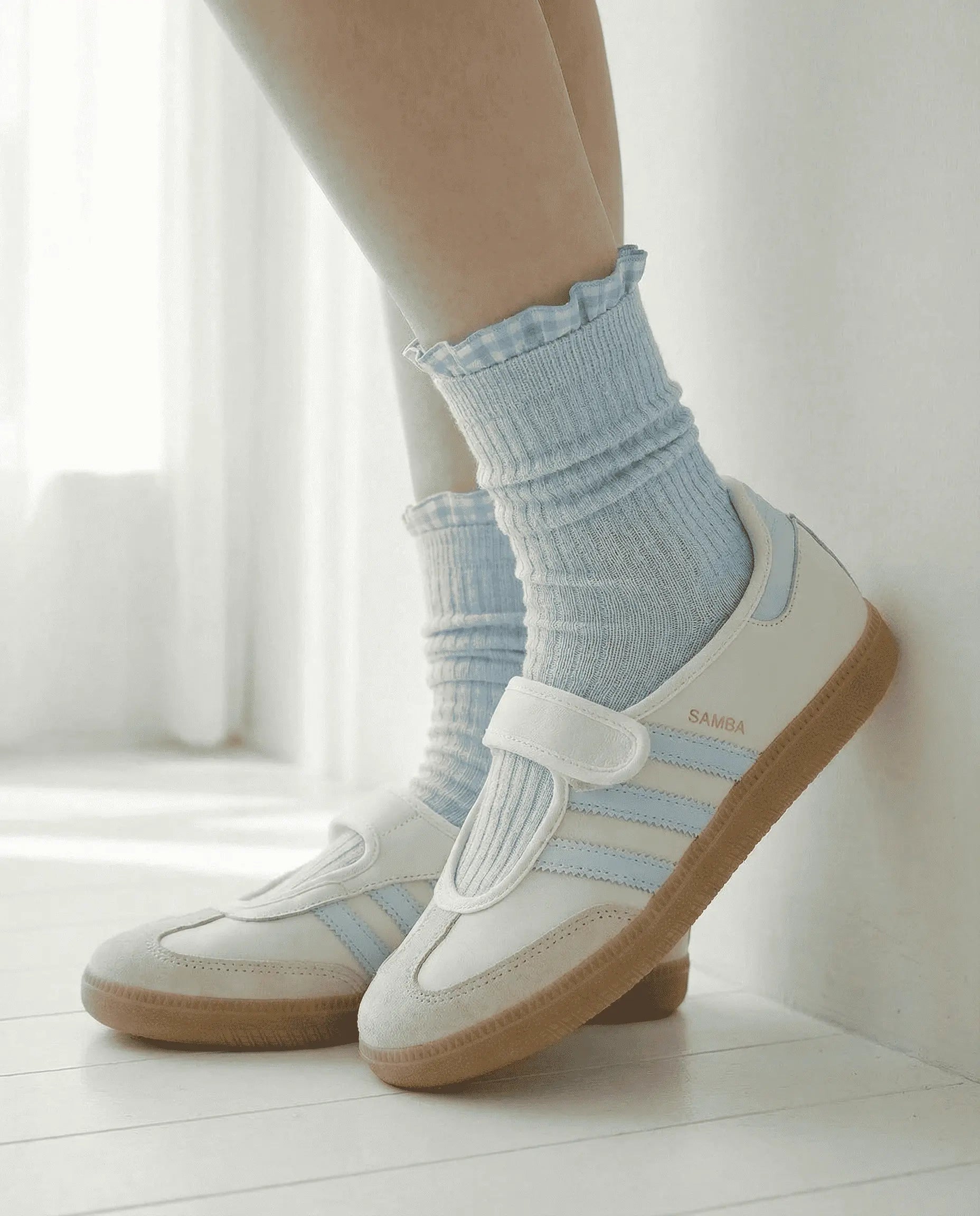 Grey Checked Ruffle Crew Socks by Sock the Luck Up. Combed cotton ribbed socks with blue gingham trim and white sneakers.