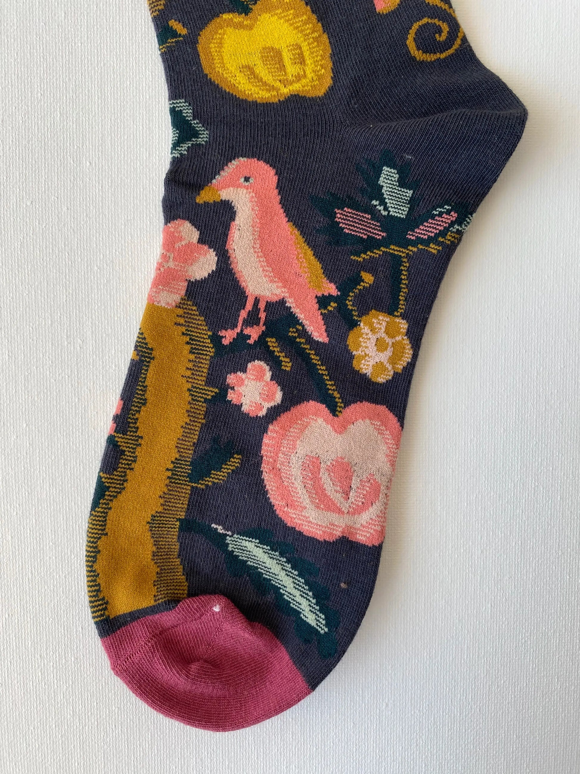 Close up of painted fruits jungle unisex crew sock toe by Sock the Luck up AU