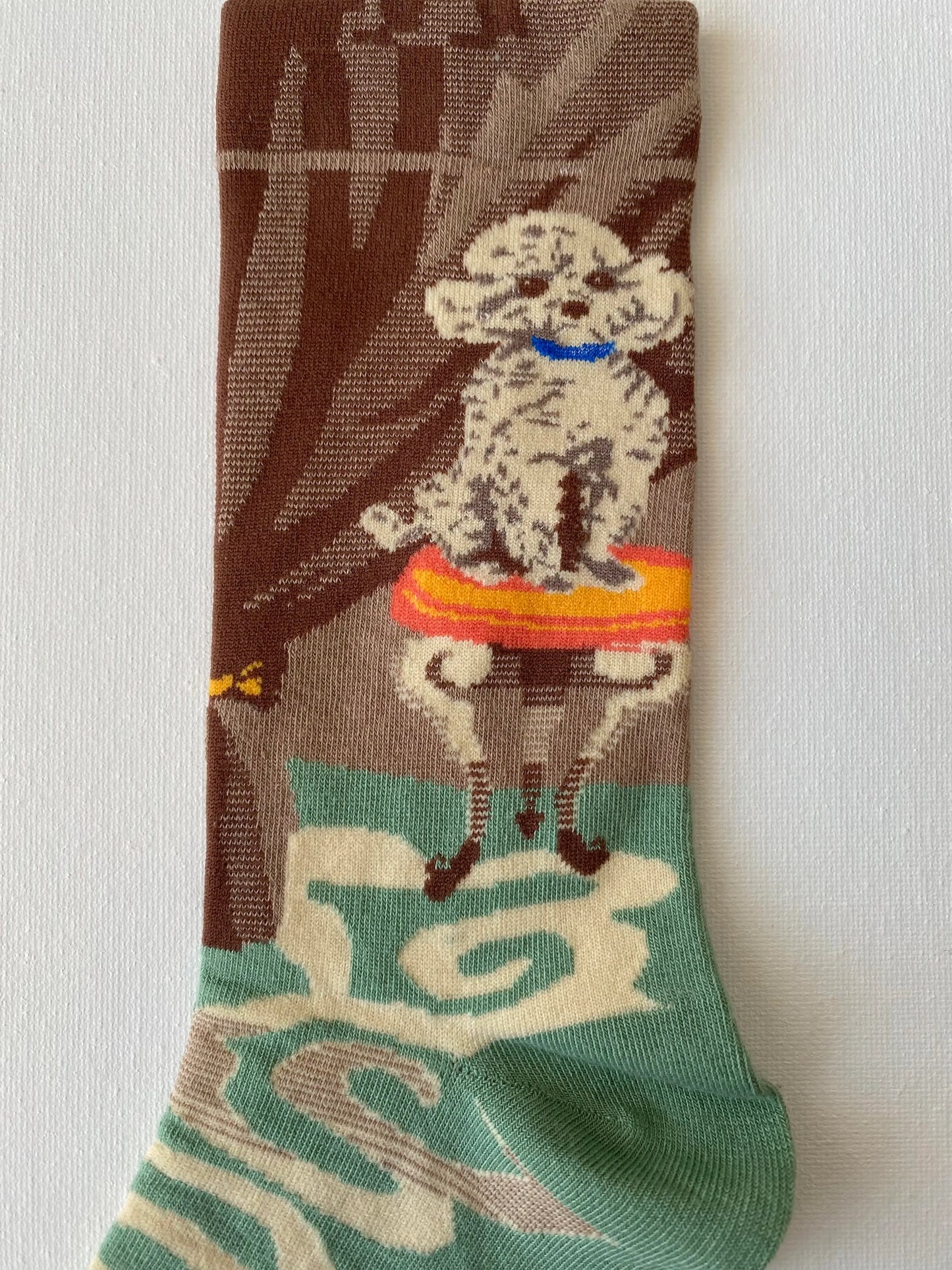 Close up of painted poodle unisex crew sock leg by Sock the Luck up AU