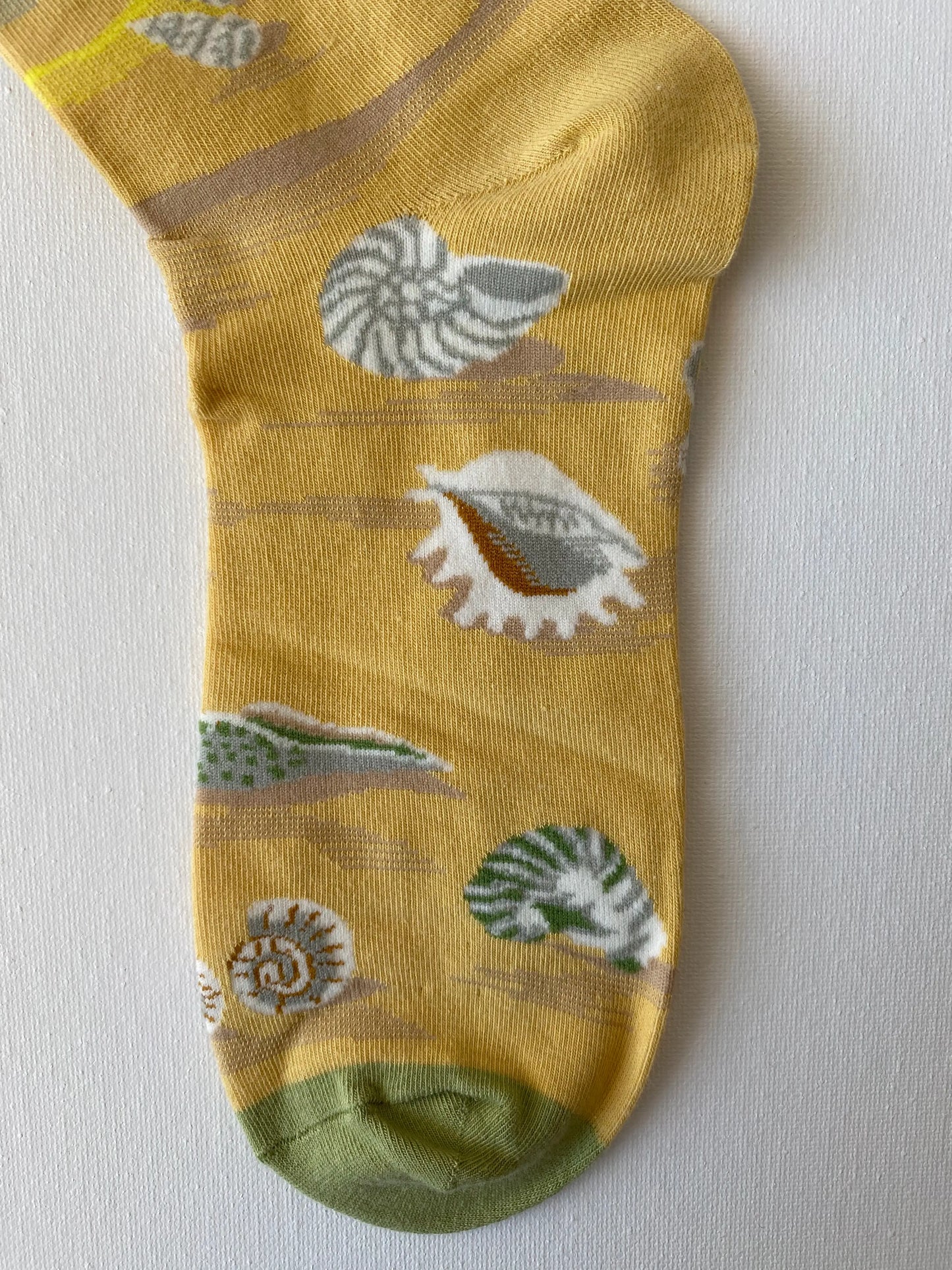 Close up of painted shells unisex crew sock toe by Sock the Luck up AU