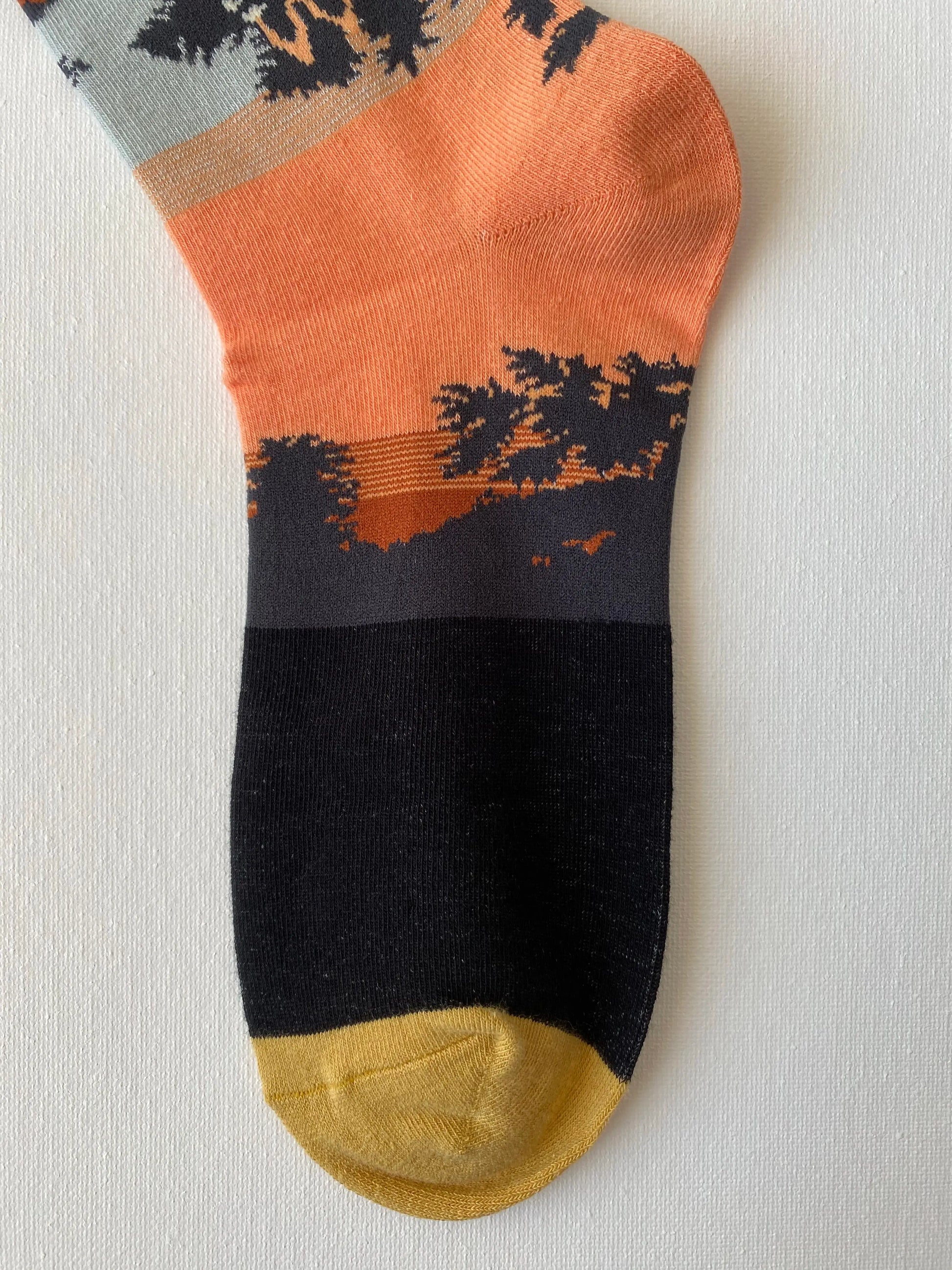 Close up of painted songbird unisex crew sock toe by Sock the Luck up AU