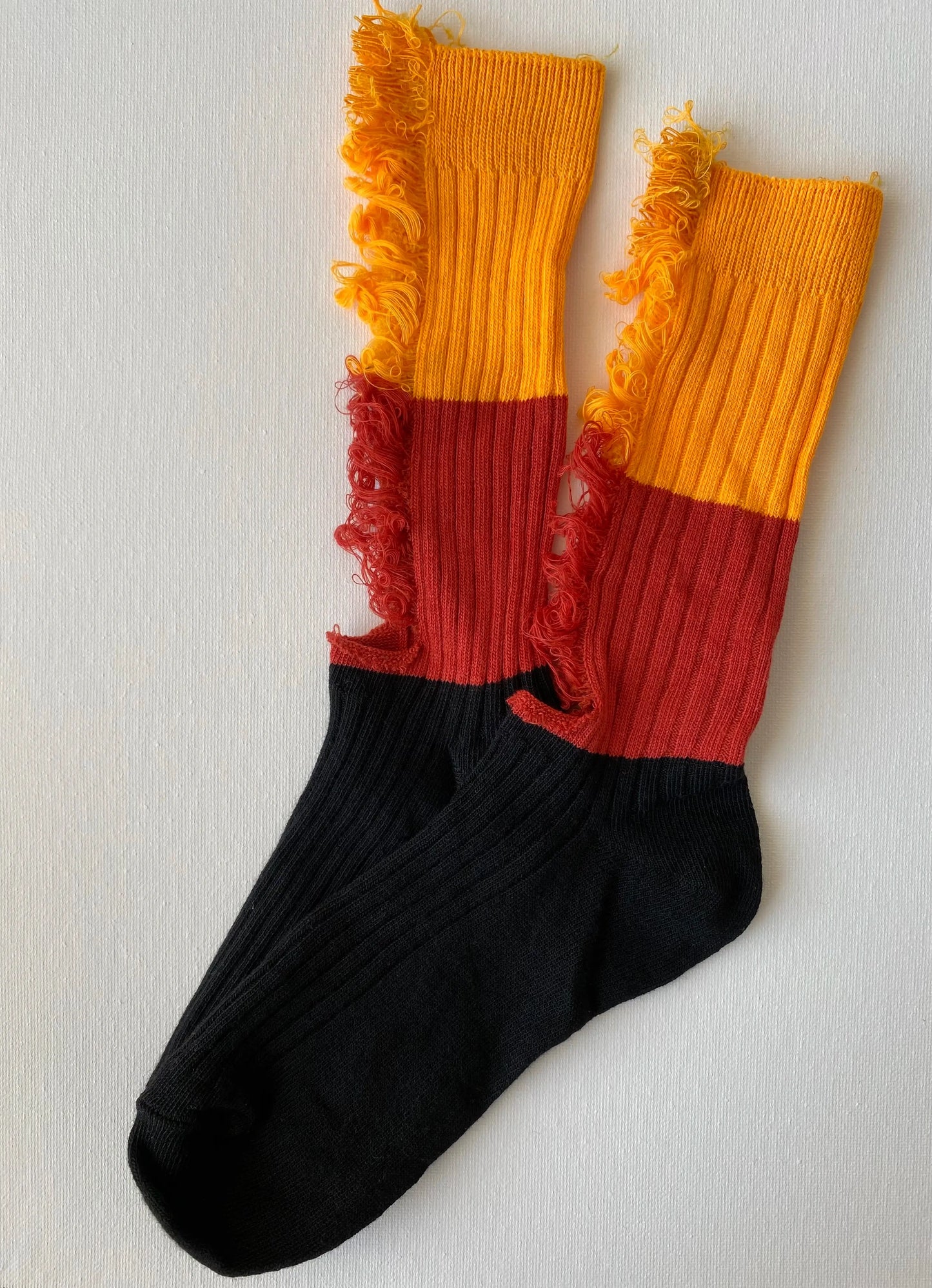 Product image of ripped unisex crew sock in orange and black colour by Sock the Luck up AU