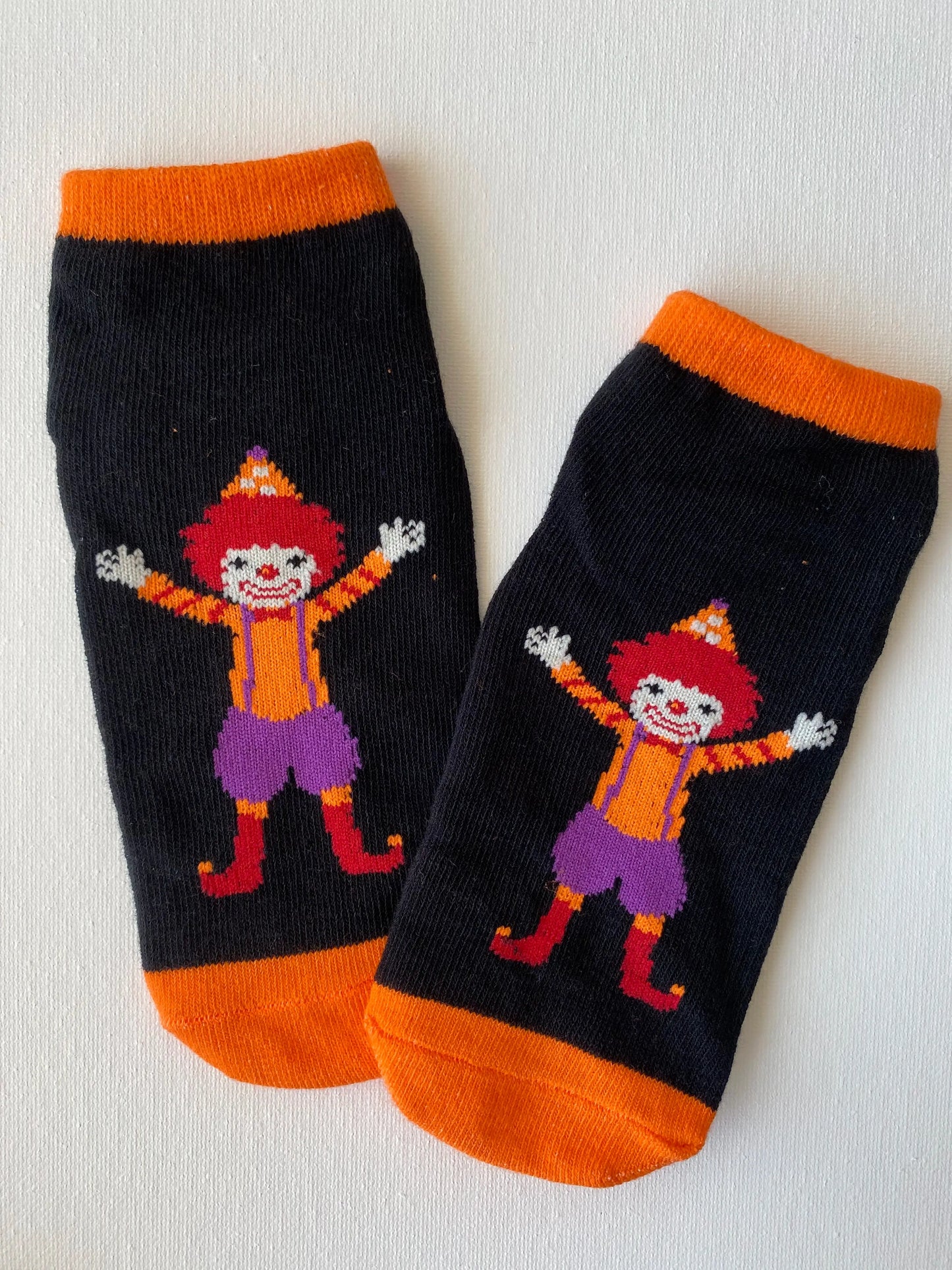 Product image of silly clown family grip sock in orange colour kid size by Sock the Luck up AU