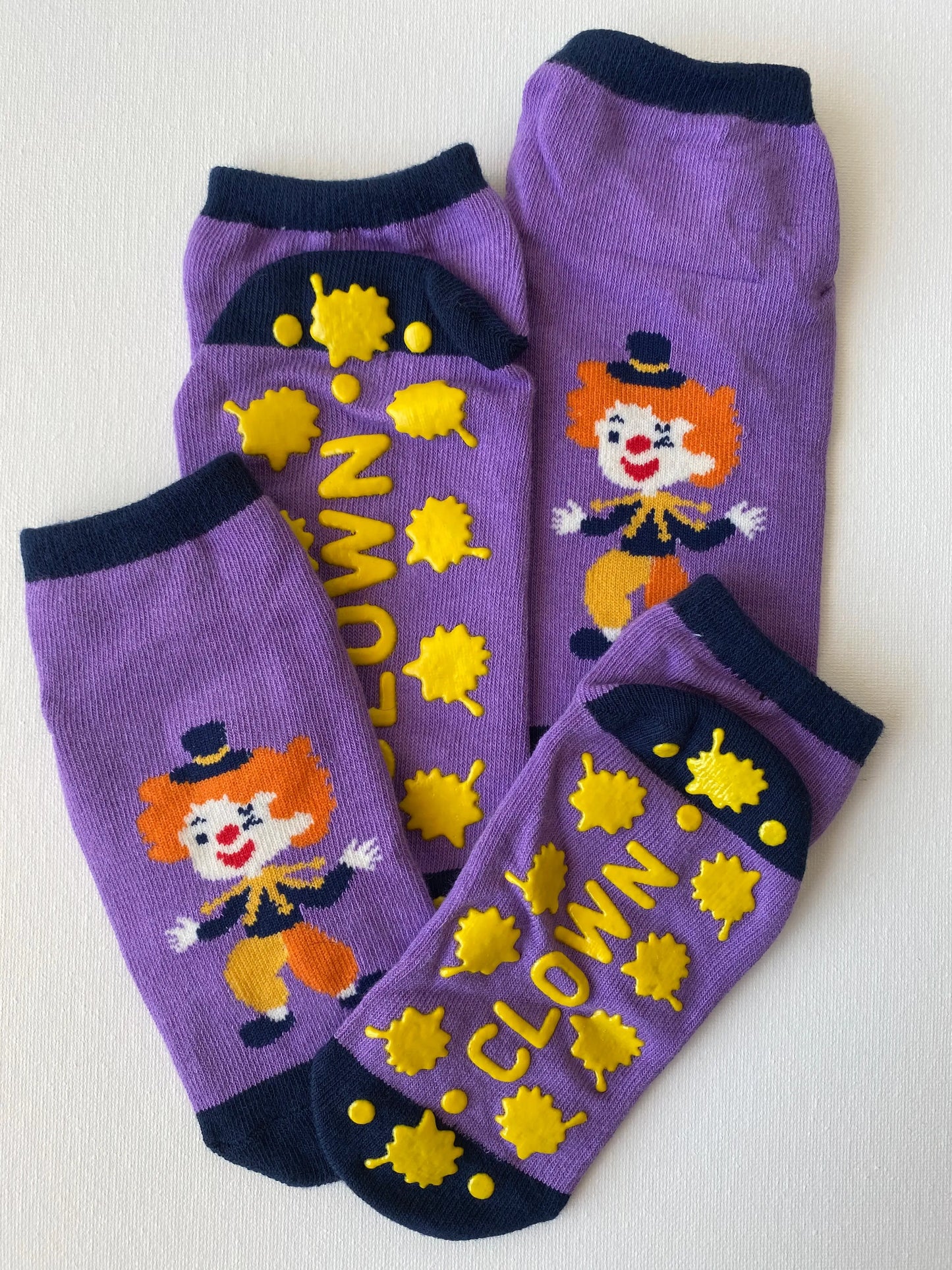 Closeup of silly clown family grip sock in purple colour entire set