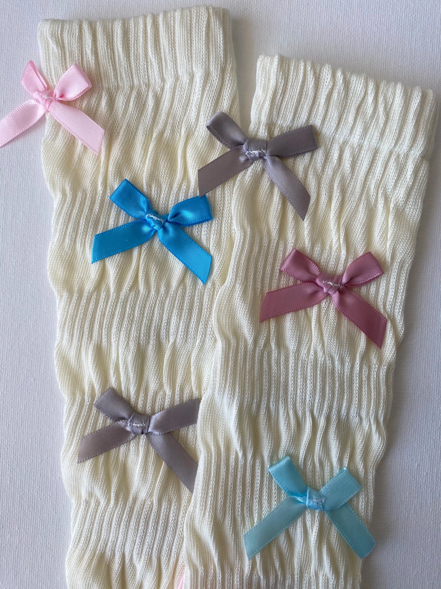 Closeup of slouched rainbow bow mid calf crew sock leg details