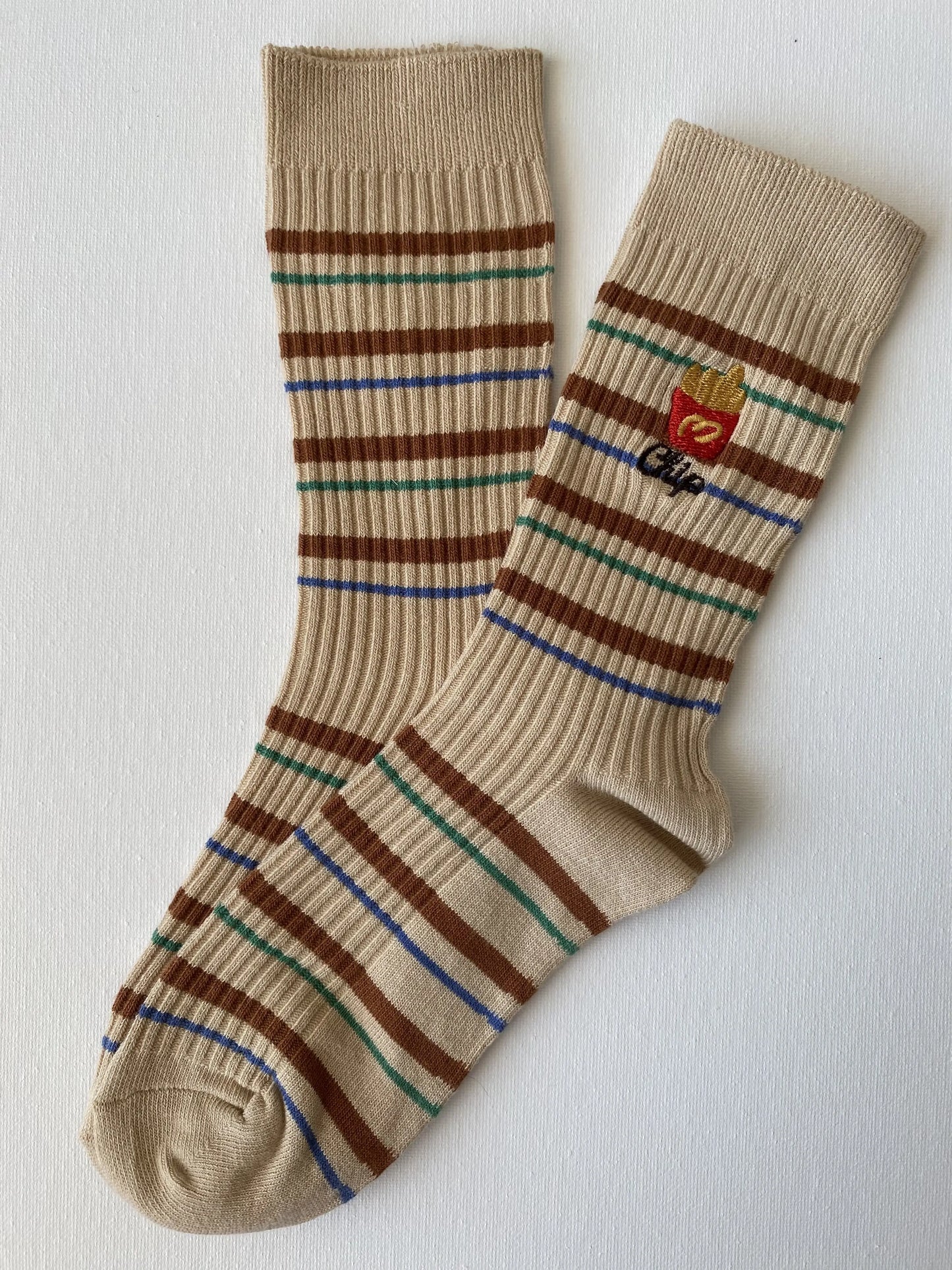 Product image of snack break striped crew sock in beige colour with a packet of fries motif by Sock the Luck up AU