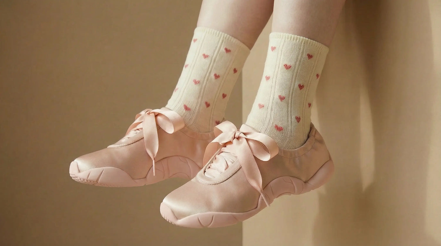 Sweet Heart collection socks with mesh details paired with lace pink ballet sneakers, evoking a soft, romantic, and feminine style