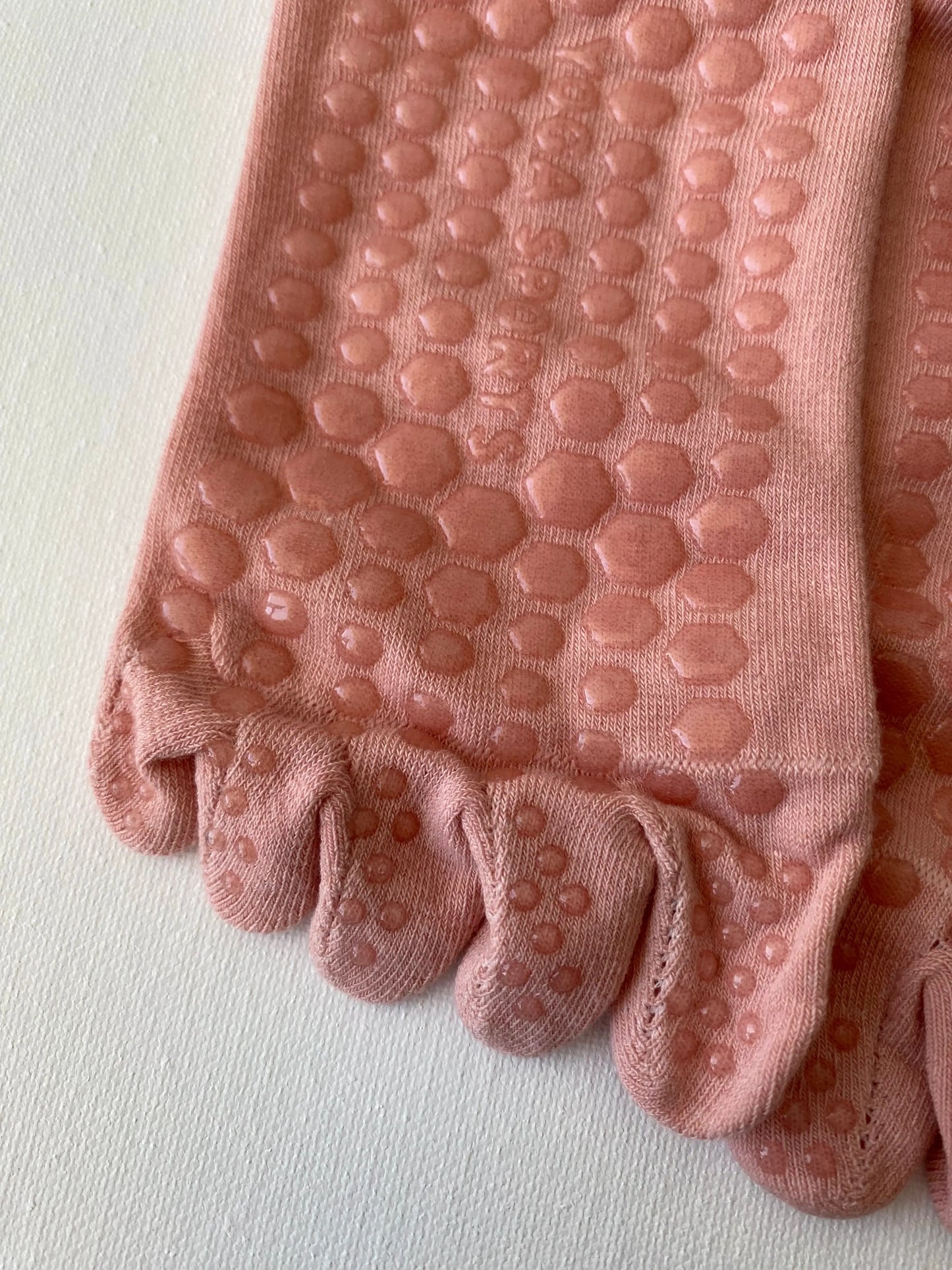 Tiptoe animal grip toe sock pink cat macro detail of silicone dot pattern on sole