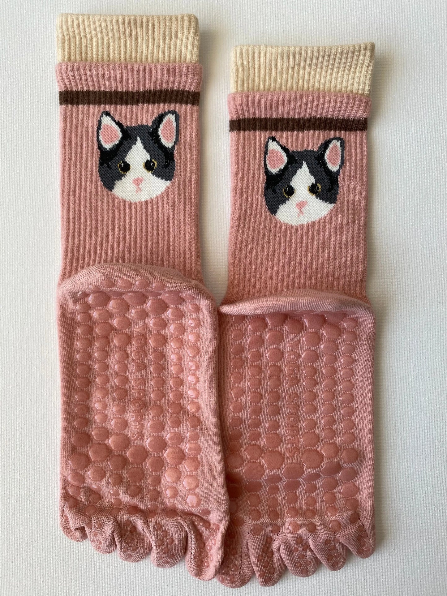 Product image of tiptoe animal grip toe sock in pink colour with a cat motif by Sock the Luck up AU