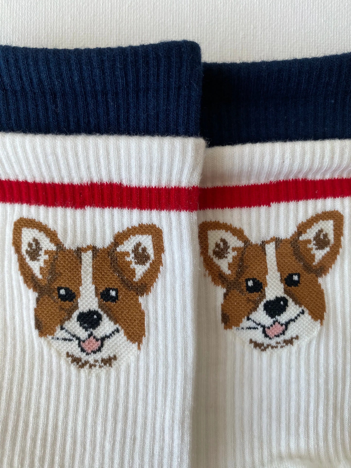 Closeup of tiptoe animal grip toe sock corgi motif cuff details 