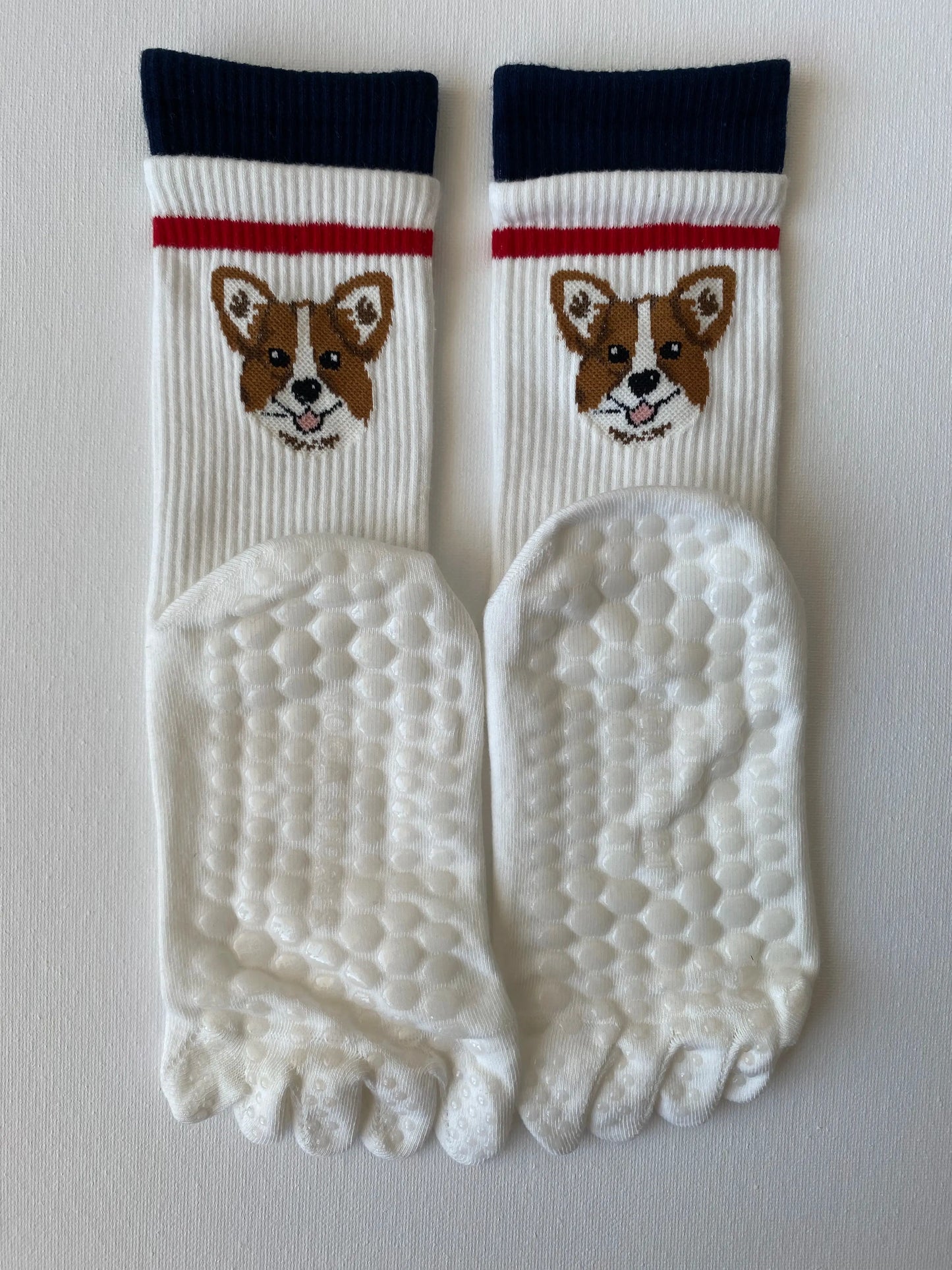Product image of tiptoe animal grip toe sock in white colour with a dog motif by Sock the Luck up AU